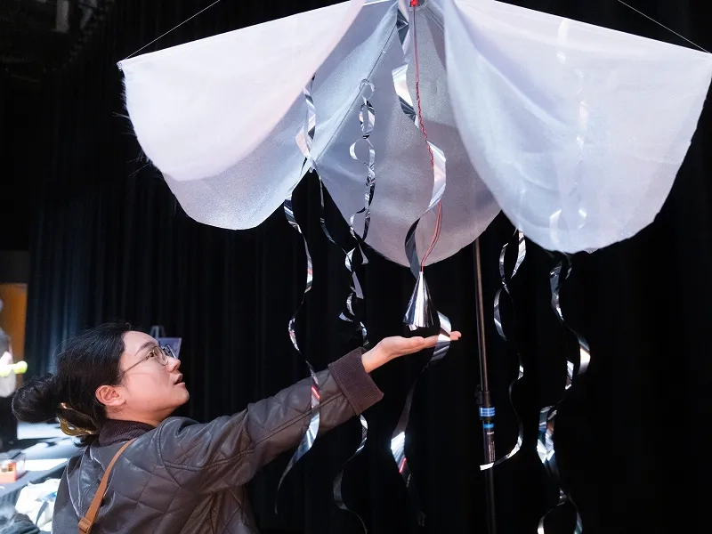 Student interacts with a Kinetic Fabrics project.