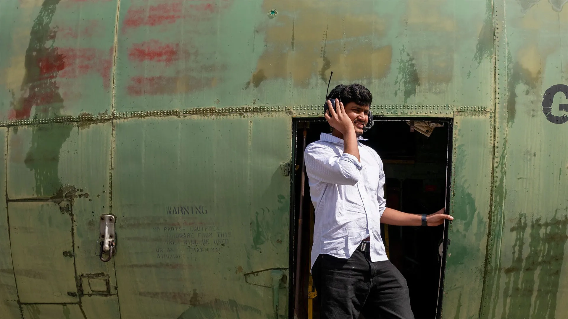 Carnegie Mellon student emerging from a military plane.