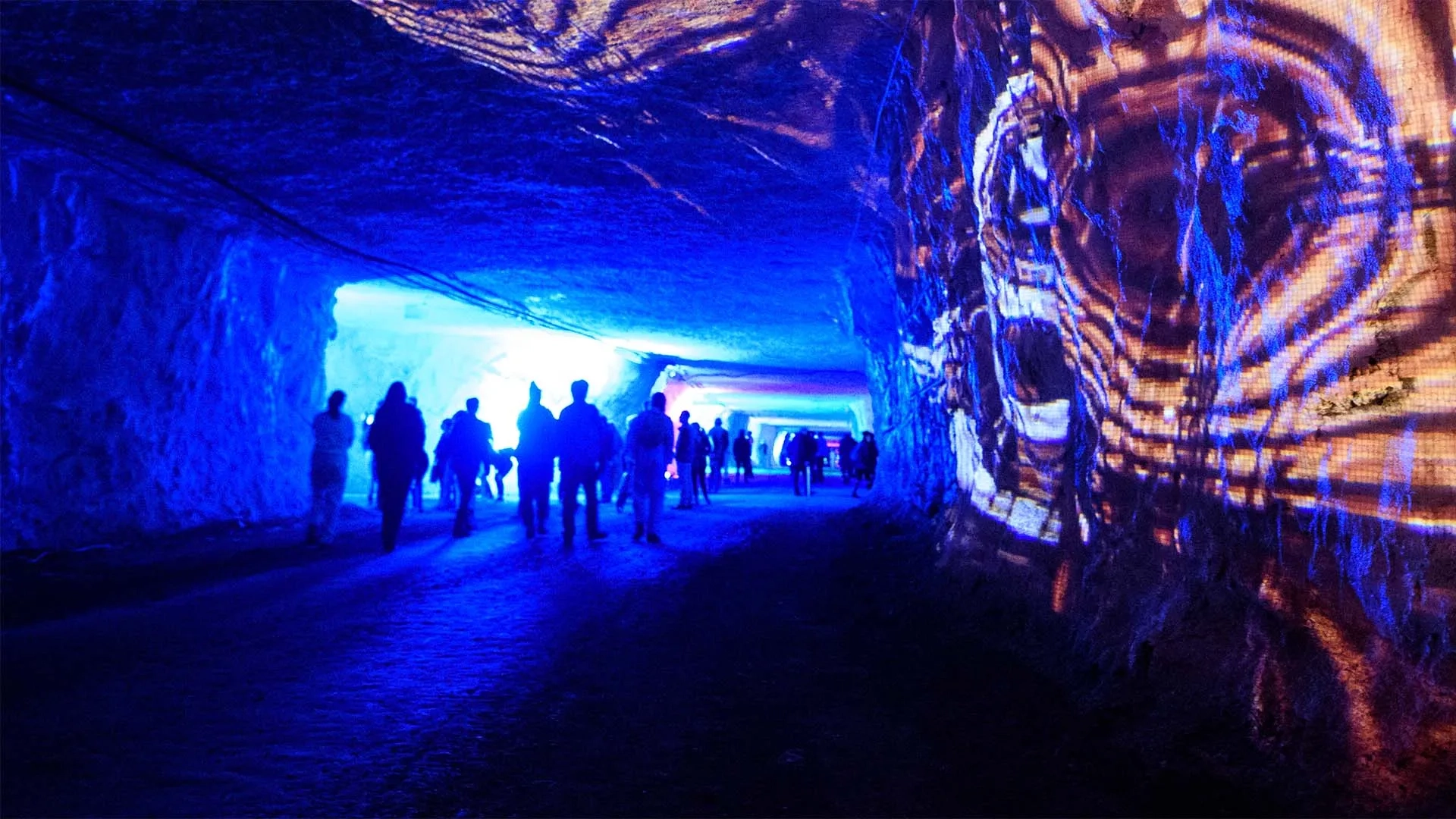 The public walking through Subsurface: an interactive exhibition where art meets music in an underground mine.
