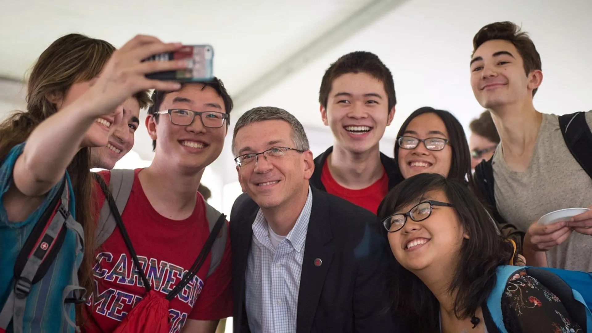 Provost Jim Garrett taking a selfie with students